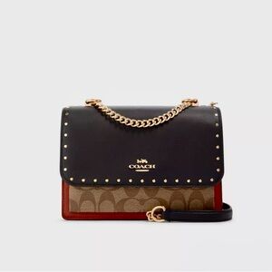 COACH Klare signature canvas and snake embossed.